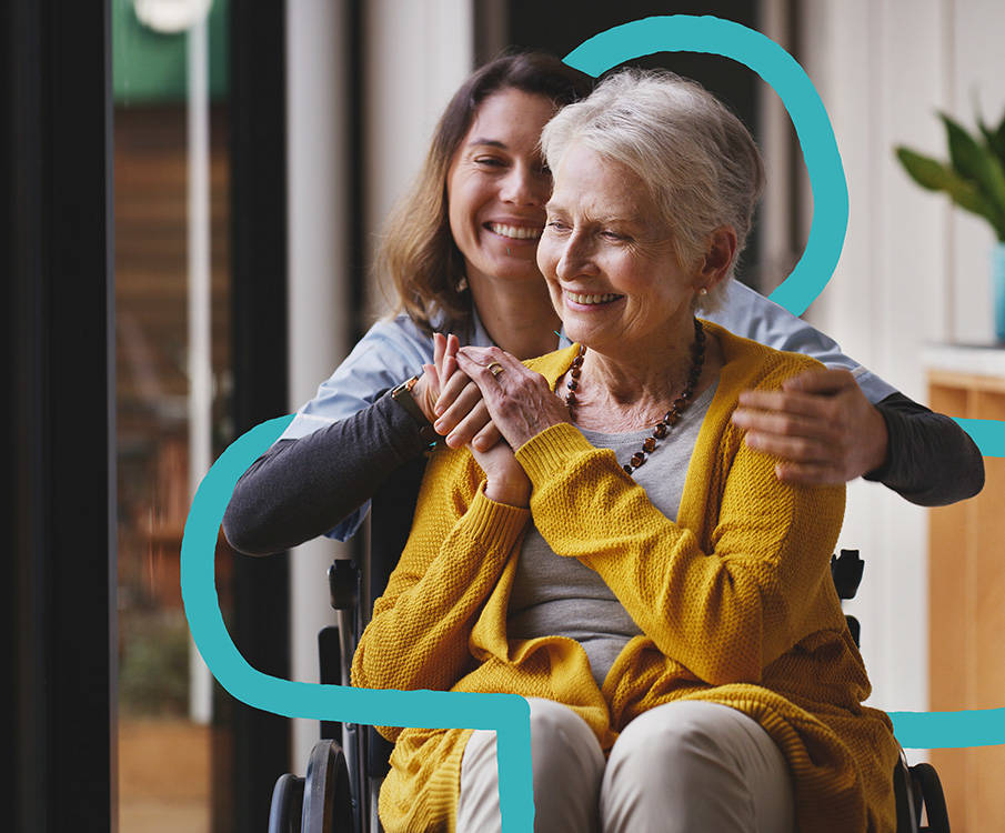 Patientin im Rollstuhl und Pflegerin